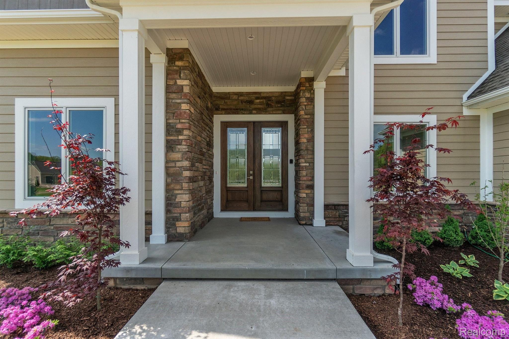 12240 Hibner Road Hartland, MI 48353 - Photo 4 of 37 Front door with landscape