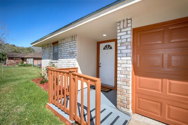 a front view of a house with garden