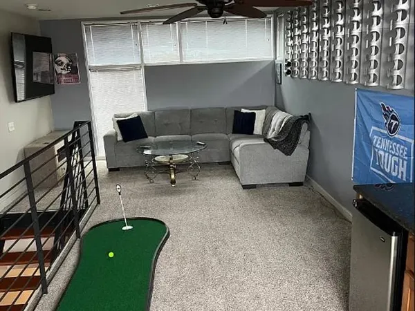 a living room with furniture and a fireplace