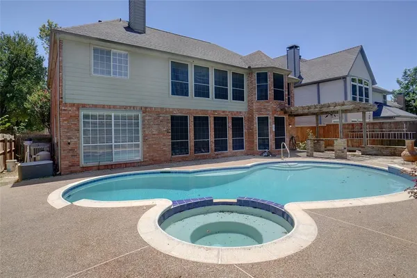 a view of pool with outdoor seating
