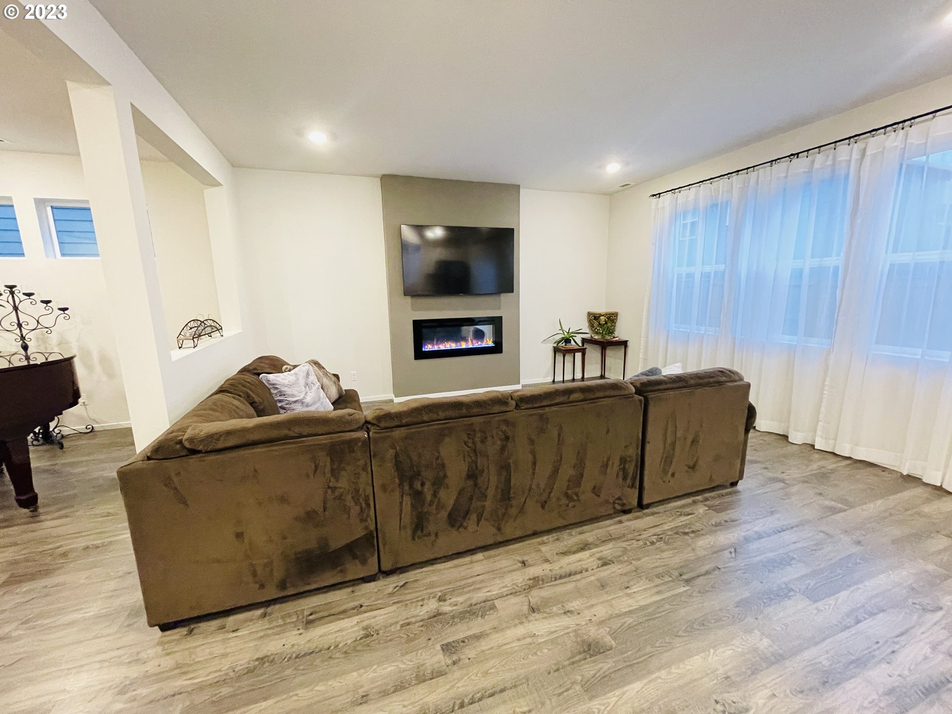 2927 W Street Springfield, OR 97477 - Photo 11 of 38 a living room with furniture and a flat screen tv