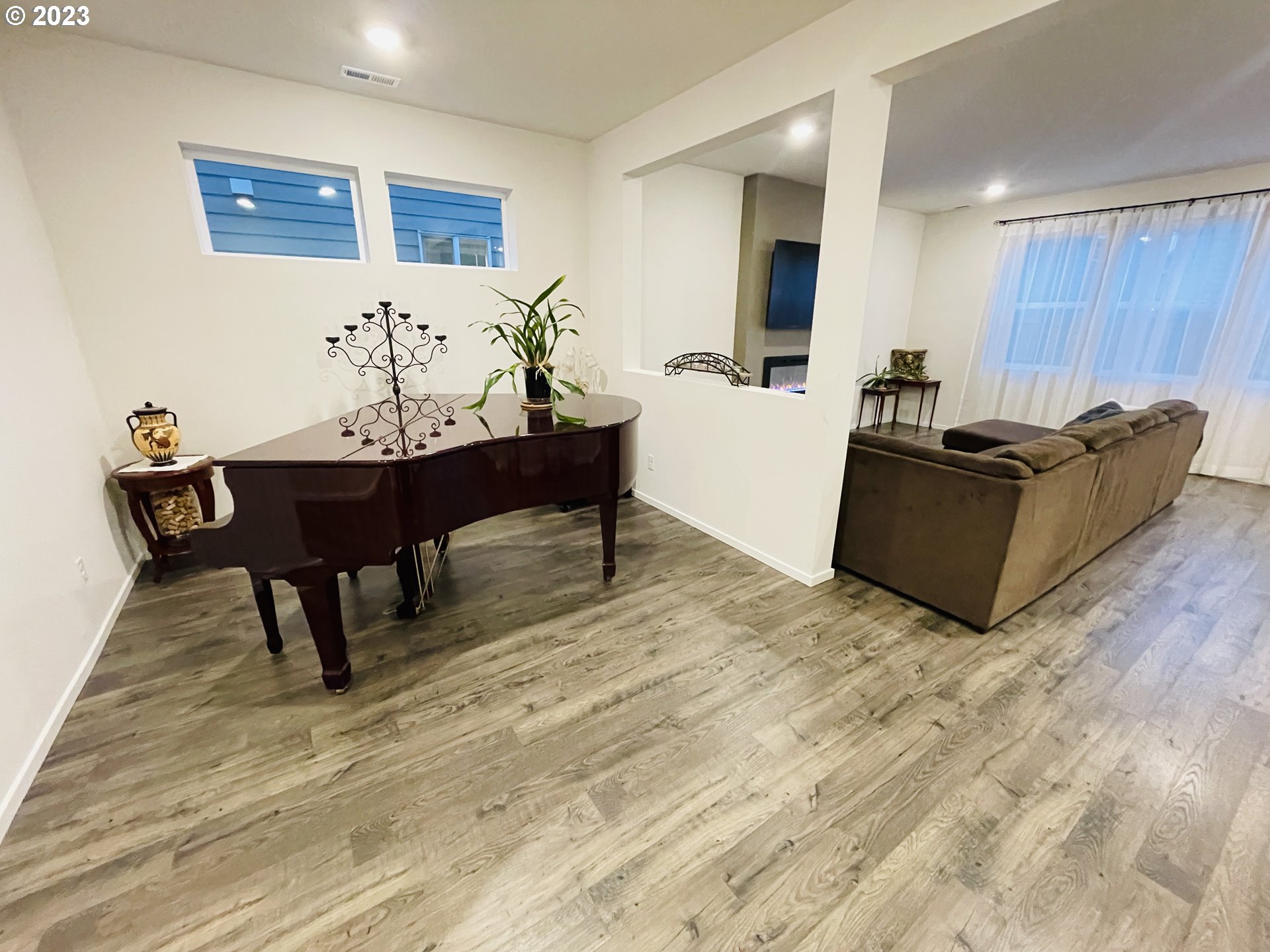 2927 W Street Springfield, OR 97477 - Photo 13 of 38 a living room with furniture and a wooden floor