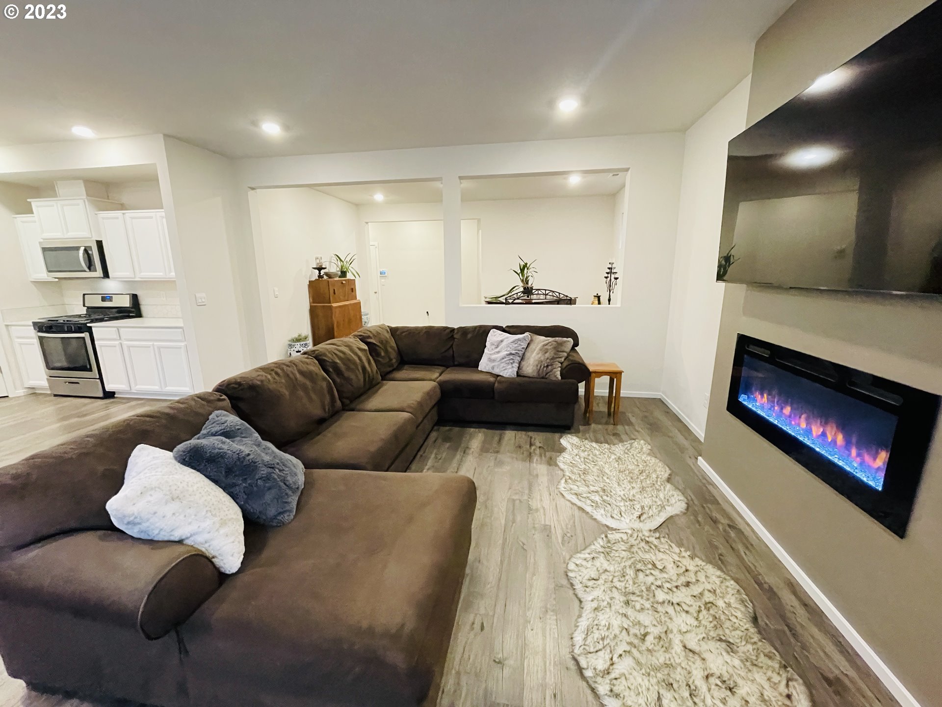 2927 W Street Springfield, OR 97477 - Photo 14 of 38 a living room with furniture and a fireplace