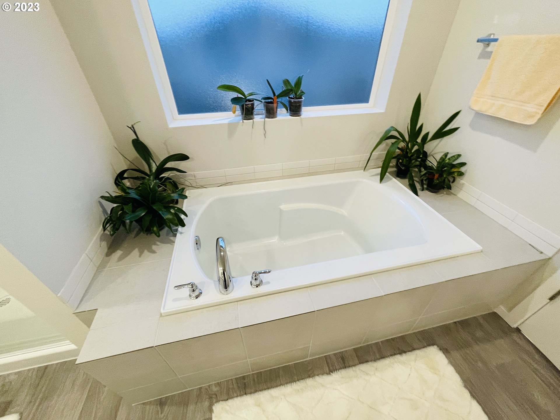 2927 W Street Springfield, OR 97477 - Photo 23 of 38 a white bath tub sitting next to a white wall