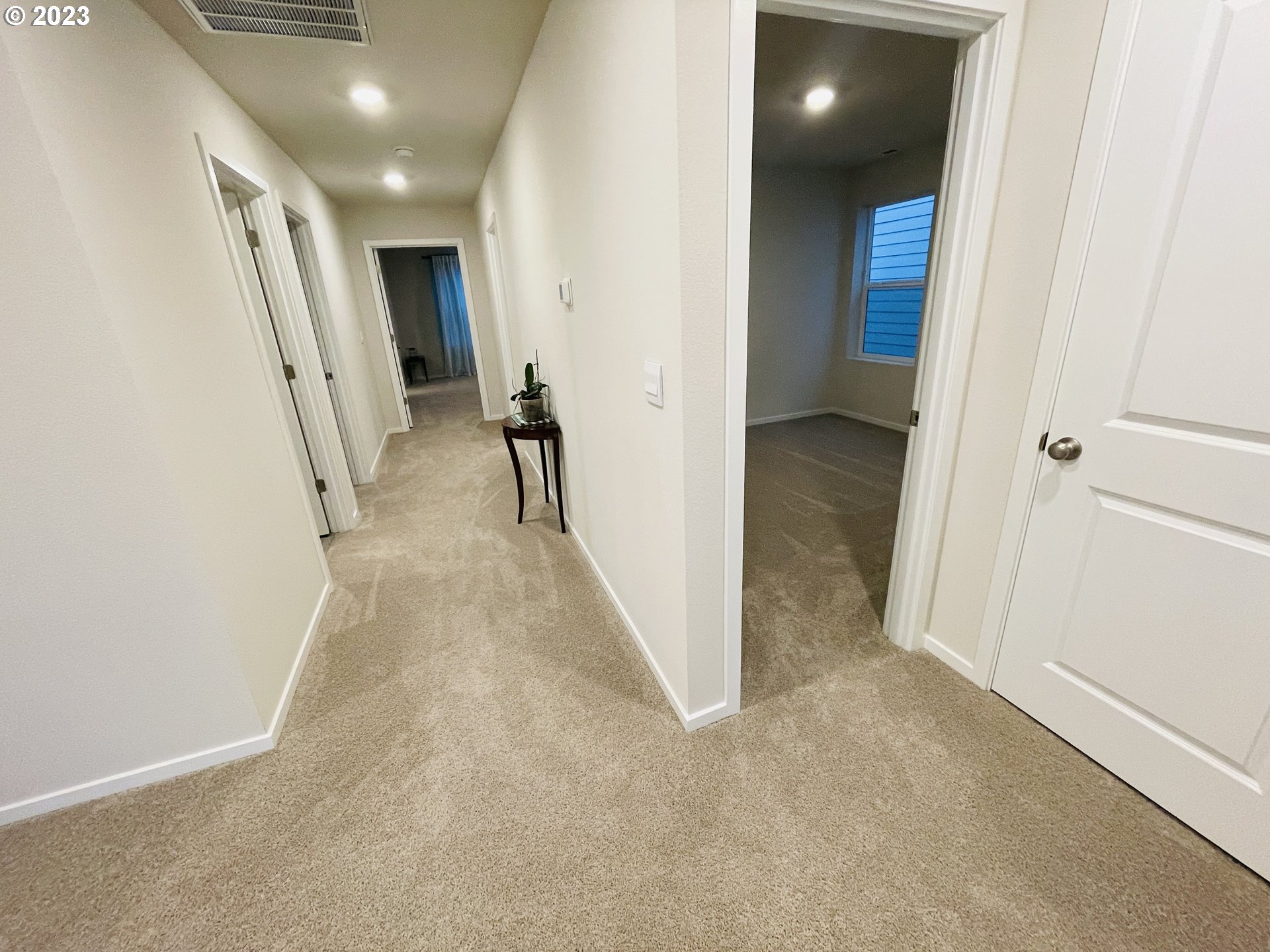 2927 W Street Springfield, OR 97477 - Photo 26 of 38 a view of hallway with stairs and wooden floor