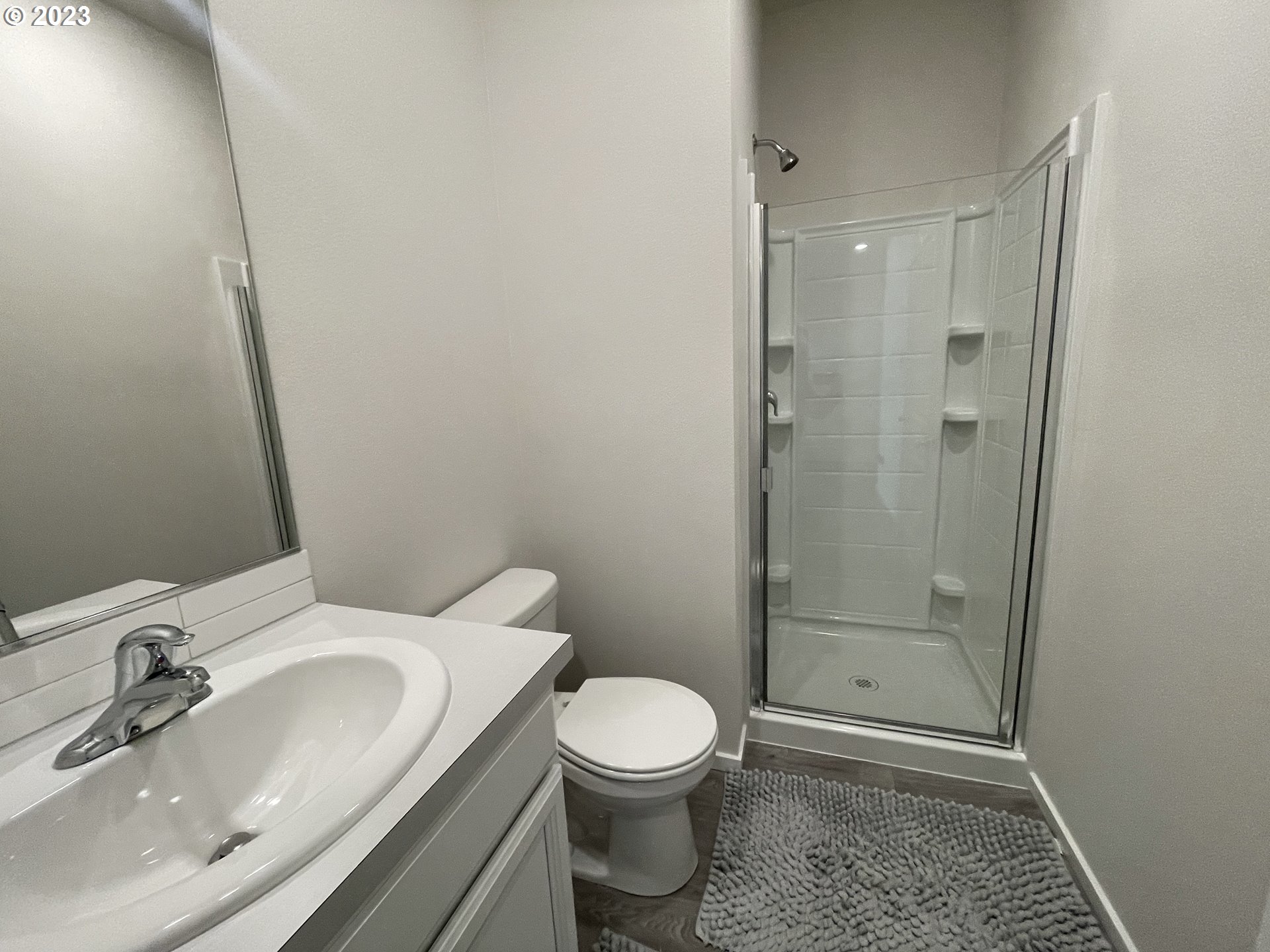 2927 W Street Springfield, OR 97477 - Photo 31 of 38 a bathroom with a sink a toilet and shower
