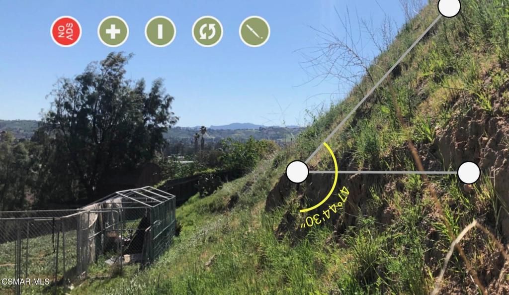 1071 Walnut Canyon Road Moorpark, CA 93021 - Photo 5 of 16 a backyard of a house with a table and chairs