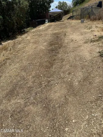 a view of backyard with outdoor space