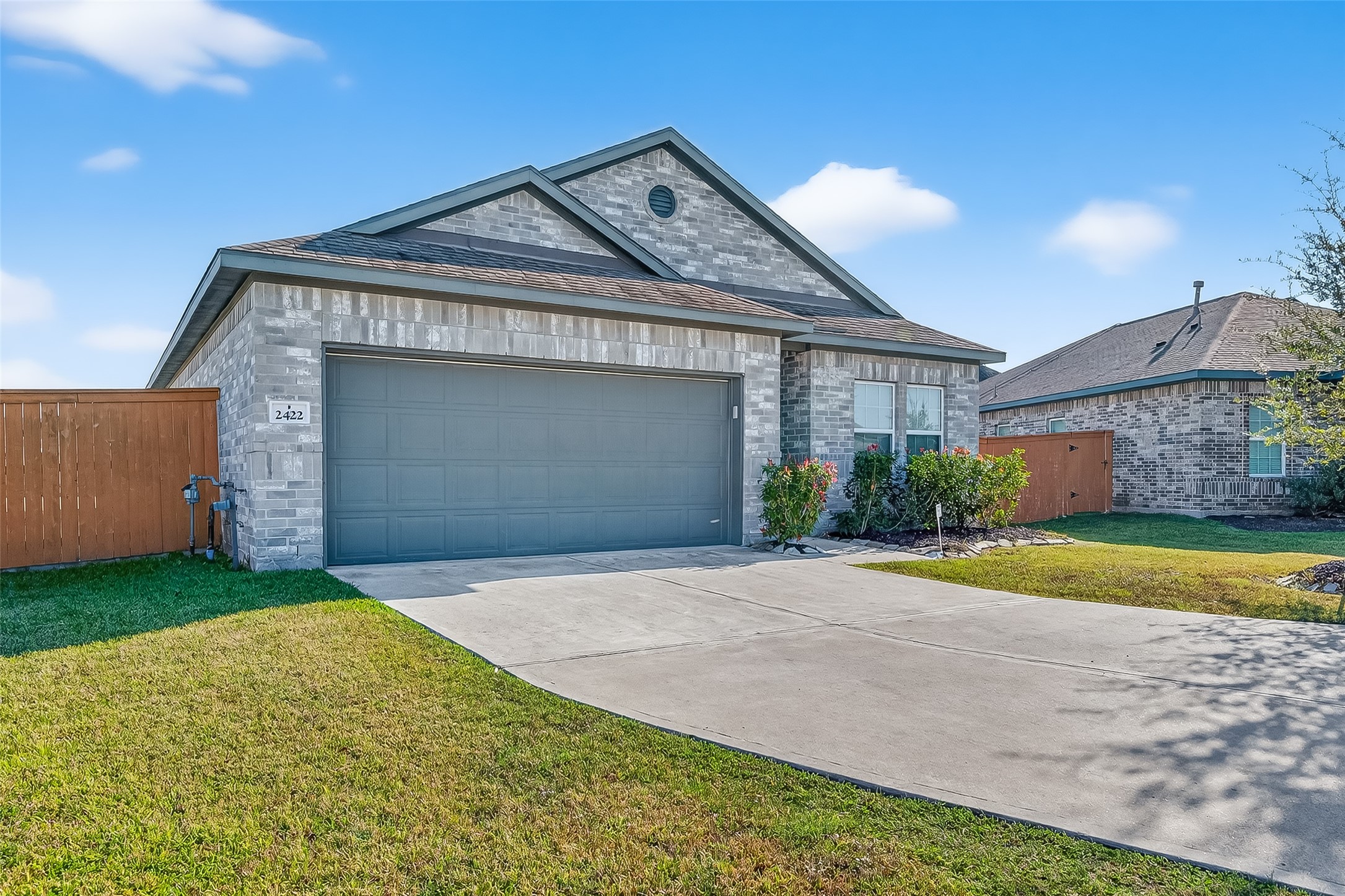 2422 Agassiz Drive Rosharon, TX 77583 - Photo 2 of 41 a front view of a house with a yard and garage