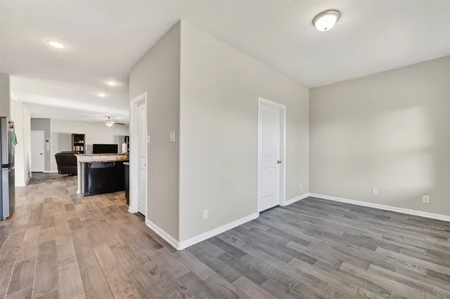 a view of kitchen with sink and refrigerator