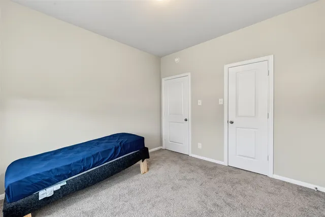 a bathroom with a sink a toilet and a large mirror