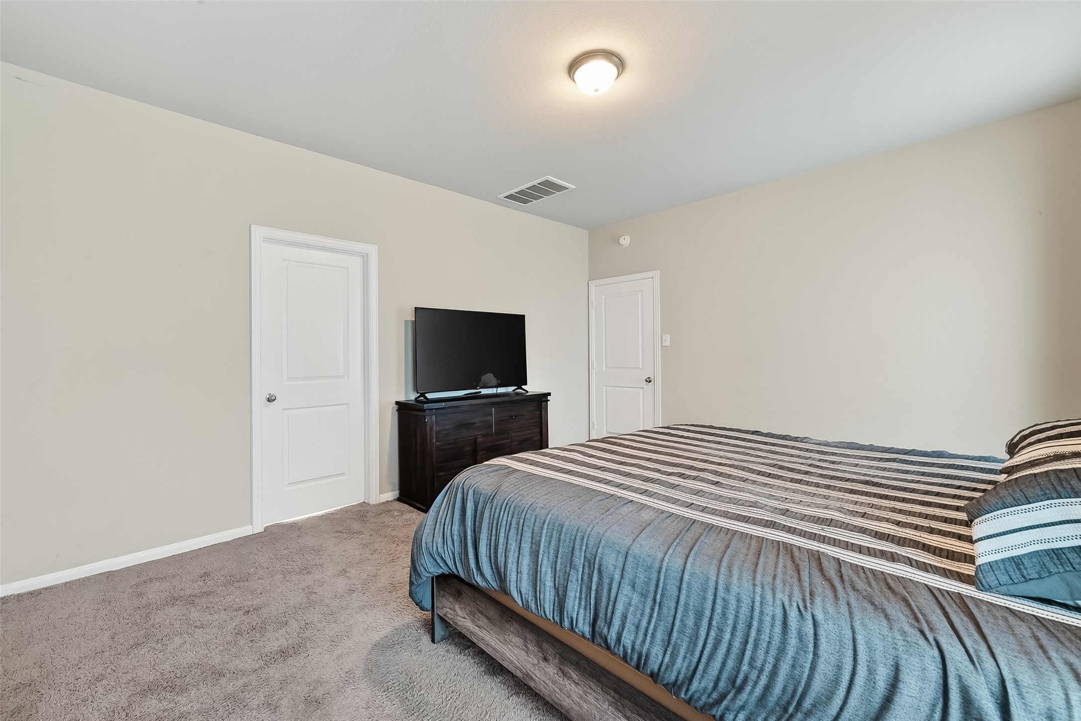 2422 Agassiz Drive Rosharon, TX 77583 - Photo 32 of 41 a bedroom with a bed and a tv