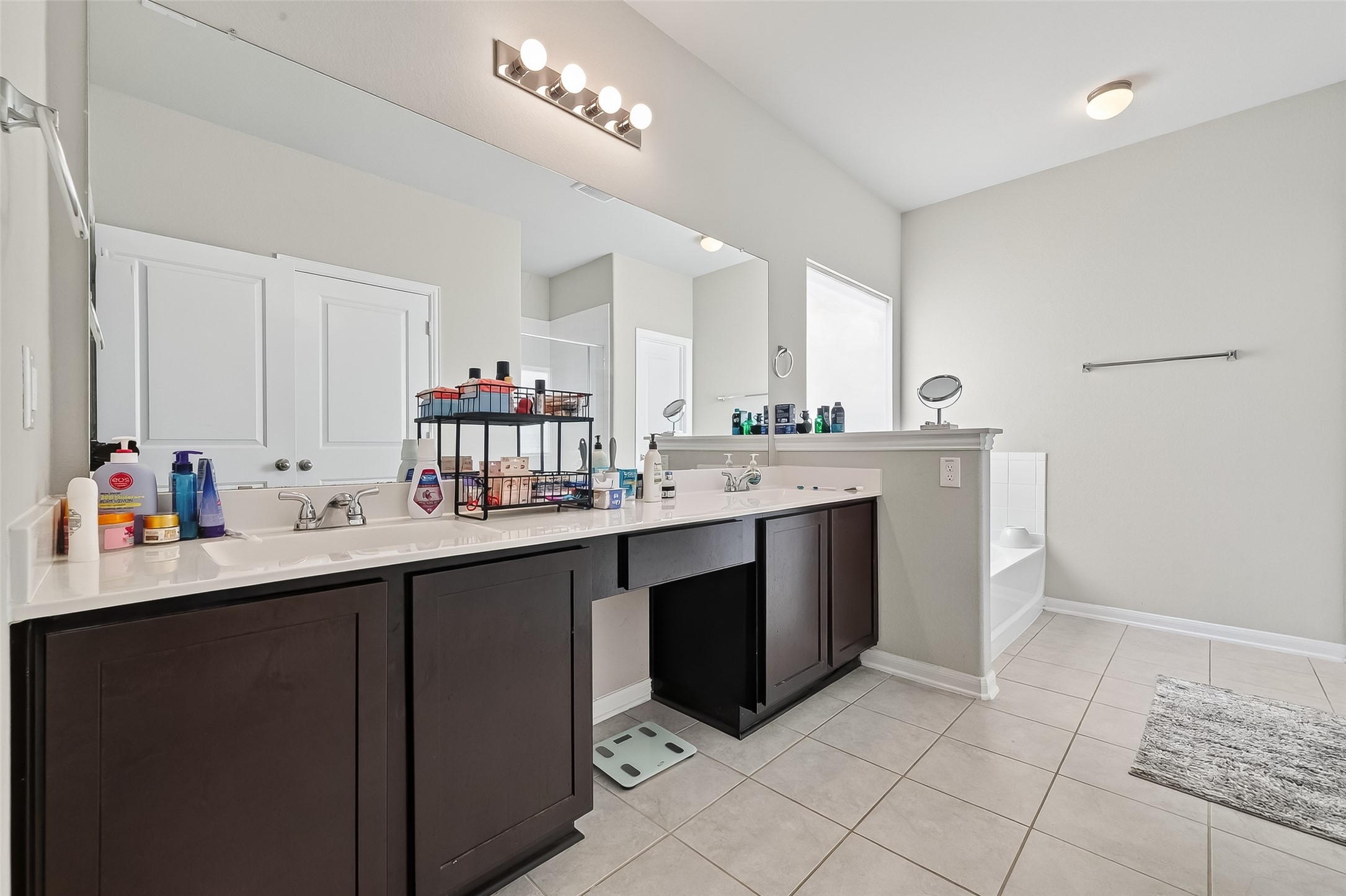 2422 Agassiz Drive Rosharon, TX 77583 - Photo 34 of 41 a kitchen with a sink dishwasher and a stove with wooden floor
