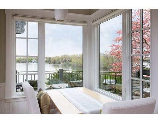 45 Hopkins Road Arlington, MA 02476 - Photo 6 of 12 a bedroom with a bed and glass window