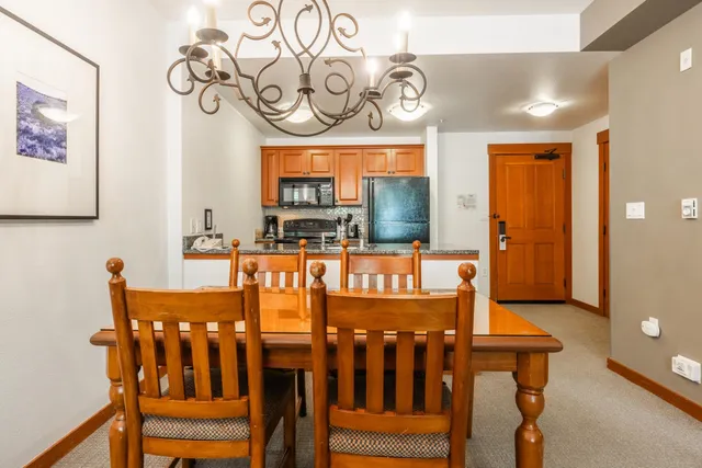 a view of a chairs and table in a room