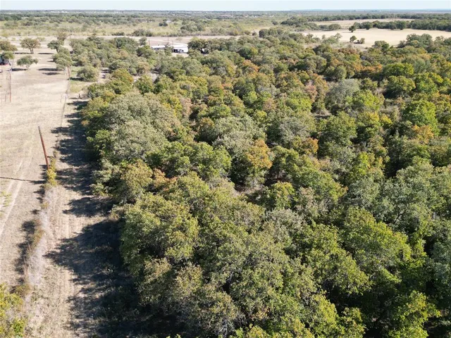 an aerial view of house with yard