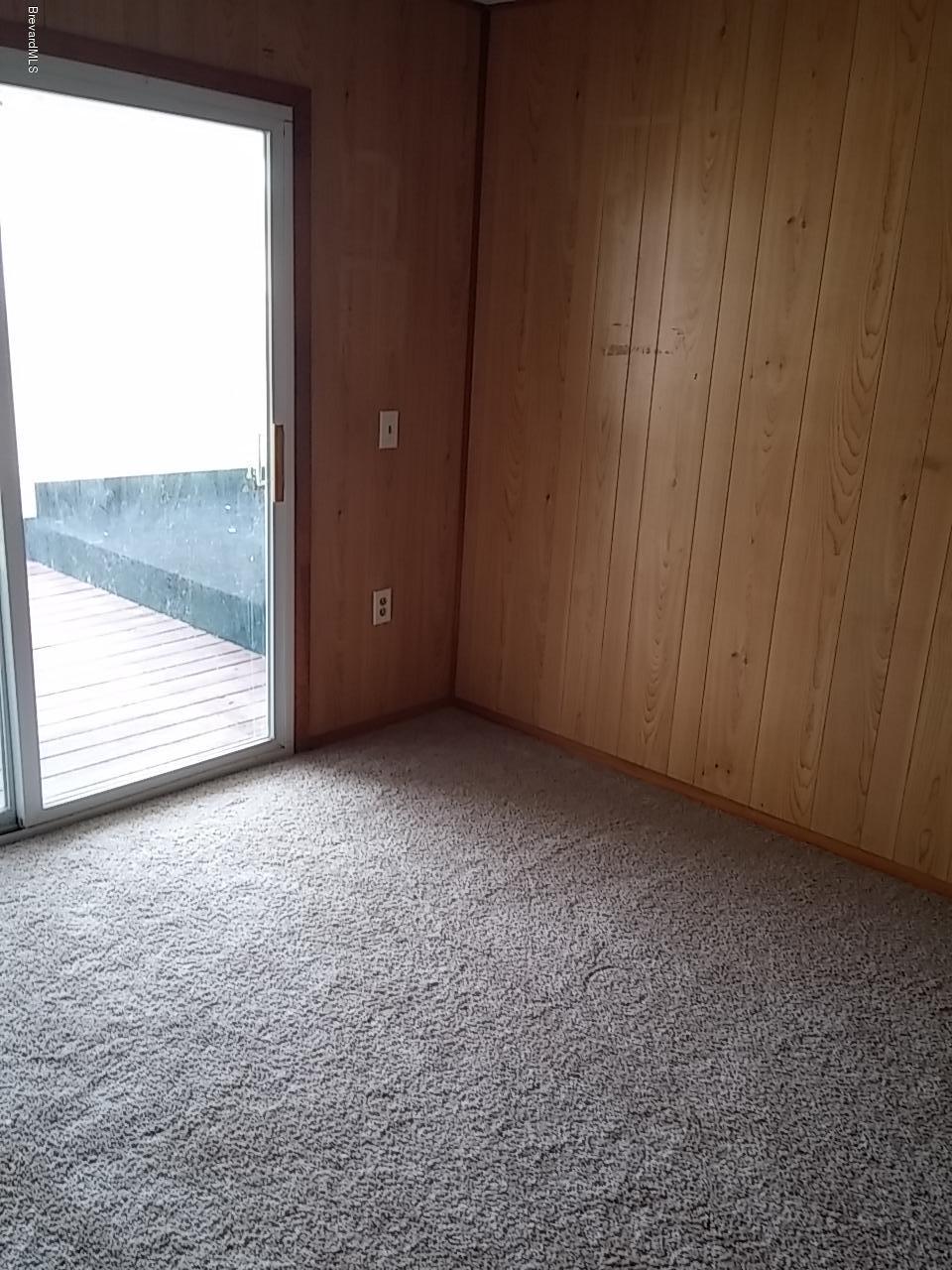 1645 Anson Road Melbourne, FL 32934 - Photo 14 of 21 a view of an empty room and window