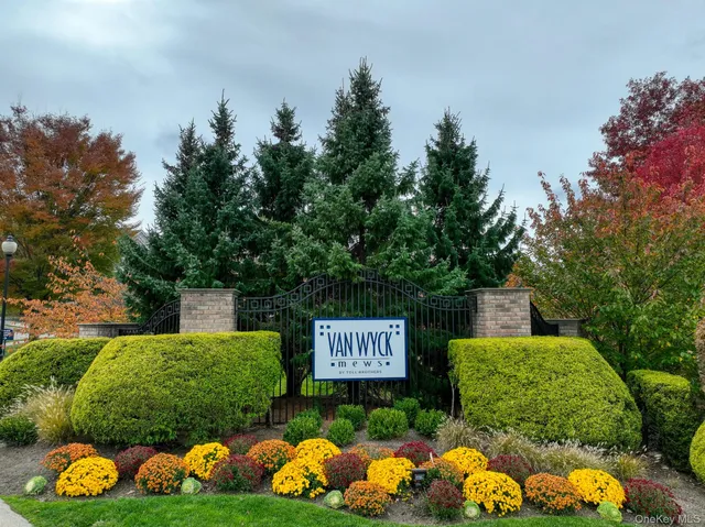 a view of a sign that is sitting in the grass