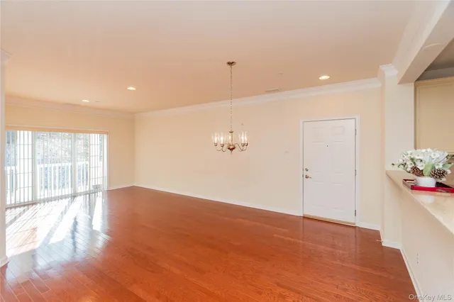 a kitchen with refrigerator and microwave