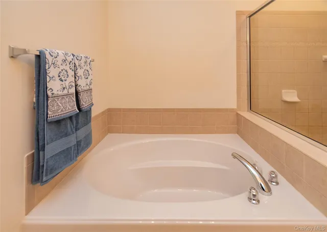 a bedroom with a bed and a view of bathroom