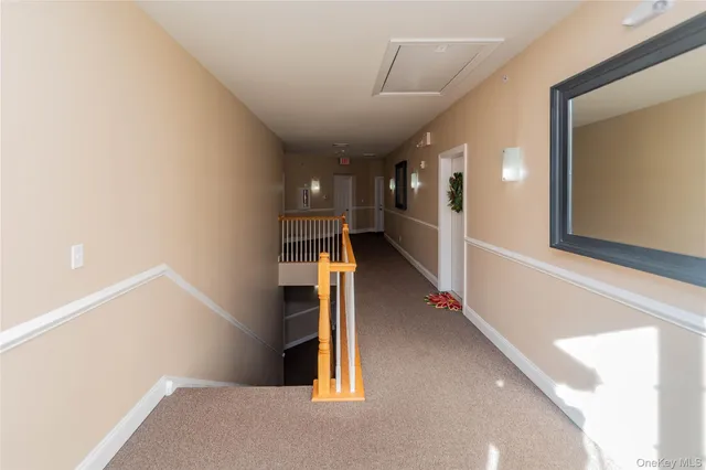 a view of a hallway with windows