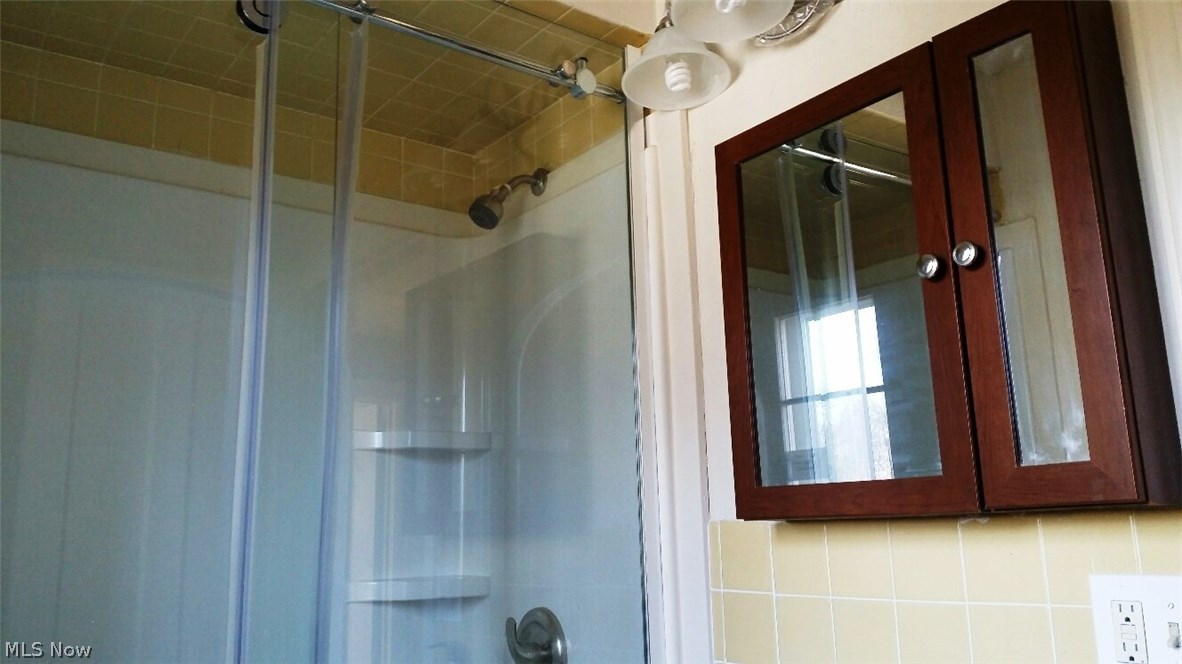3454 Warren Road Cleveland, OH 44111 - Photo 16 of 25 Second floor bathroom, completely renovated with shower on tracks with wheels, very cool.
