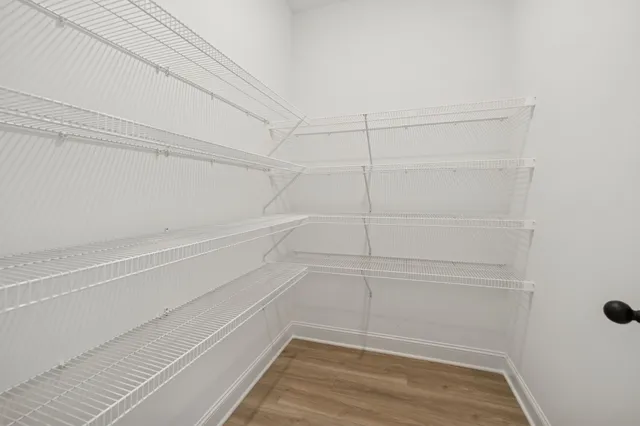 a view of a room with racks on the wall