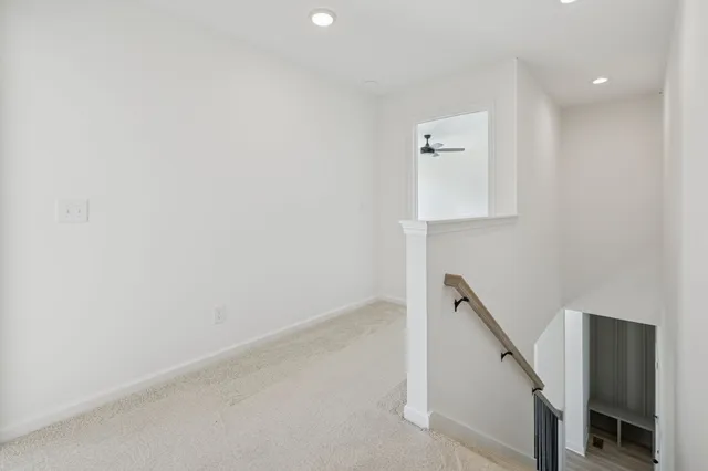 a view of a hallway with staircase