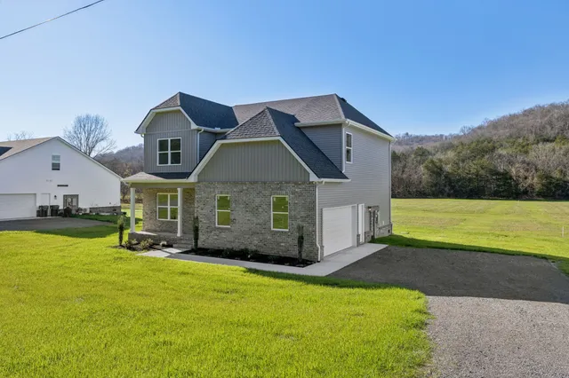 a front view of a house with yard