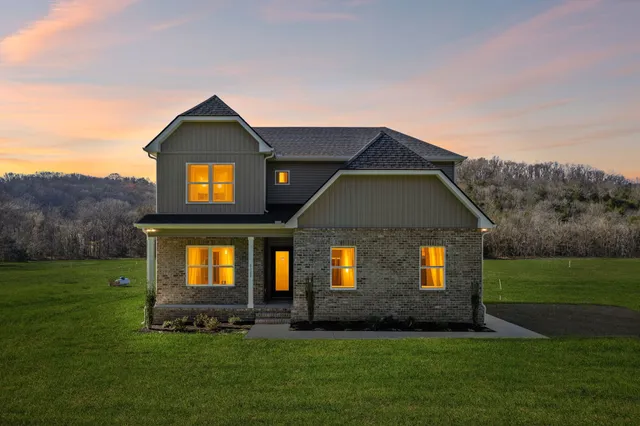 a front view of a house with a yard