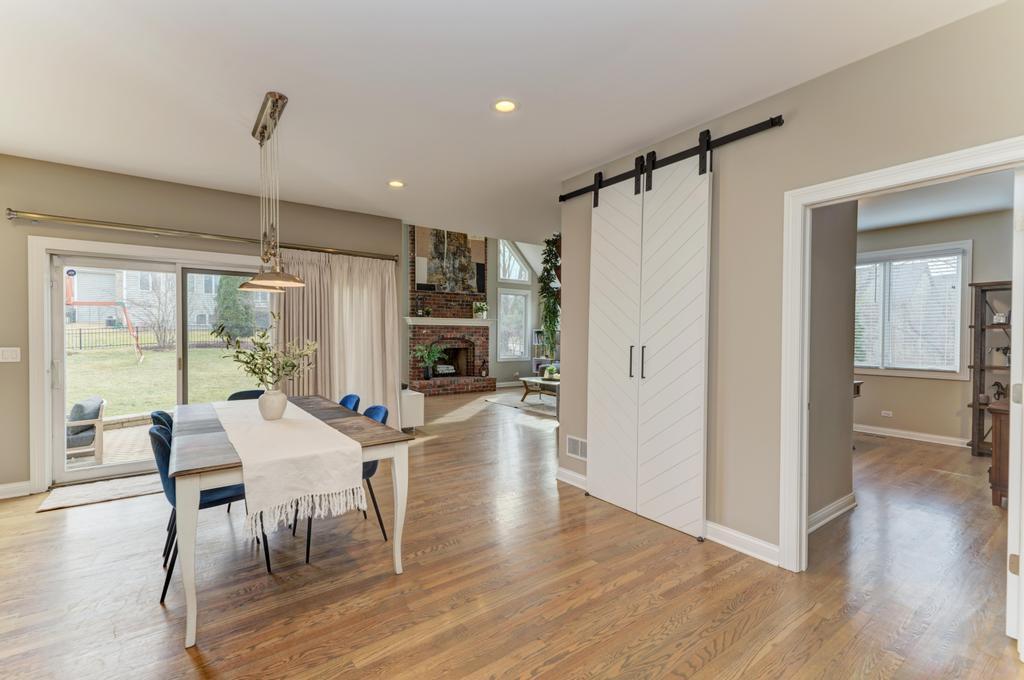 1061 Sean Circle Darien, IL 60561 - Photo 13 of 50 a view of a dining room with furniture window and wooden floor
