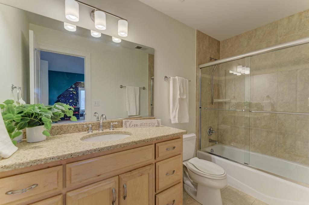 1061 Sean Circle Darien, IL 60561 - Photo 26 of 50 a bathroom with a granite countertop sink mirror toilet and bathtub