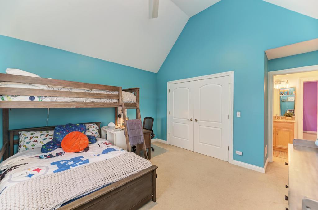 1061 Sean Circle Darien, IL 60561 - Photo 28 of 50 a bedroom with a bed and utility