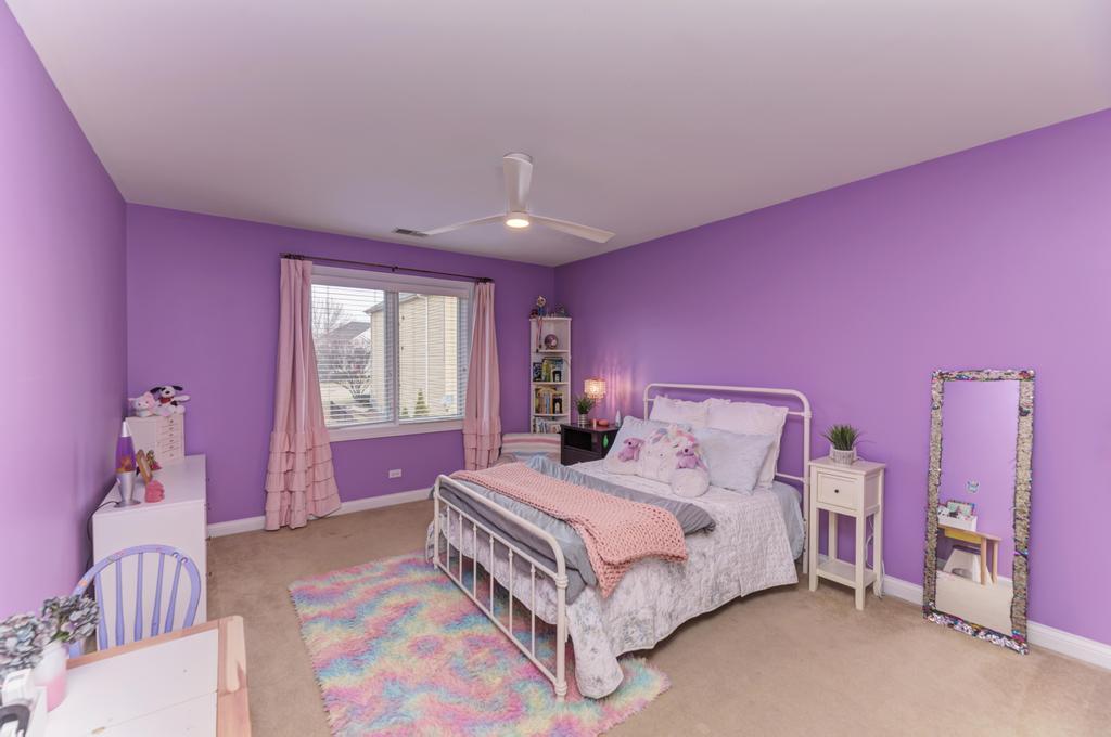 1061 Sean Circle Darien, IL 60561 - Photo 30 of 50 a bedroom with a bed and a window