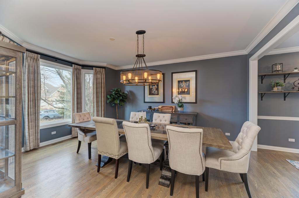 1061 Sean Circle Darien, IL 60561 - Photo 4 of 50 a view of a dining room with furniture window and wooden floor