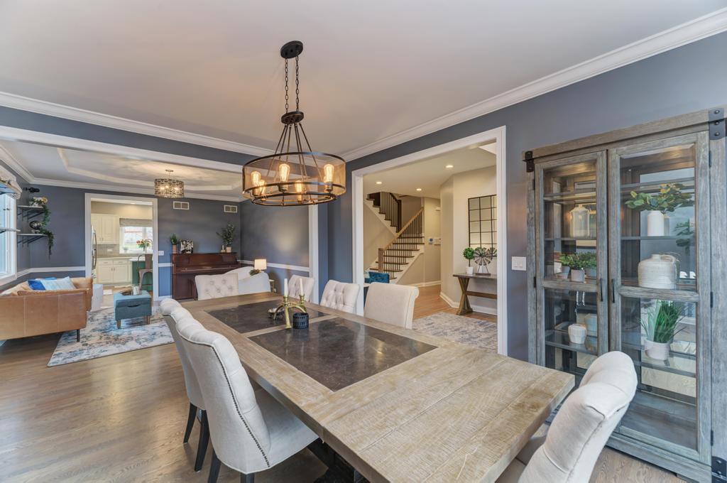 1061 Sean Circle Darien, IL 60561 - Photo 6 of 50 a view of a dining room with furniture wooden floor and chandelier
