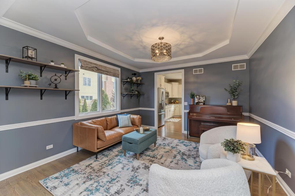 1061 Sean Circle Darien, IL 60561 - Photo 7 of 50 a living room with furniture and a chandelier