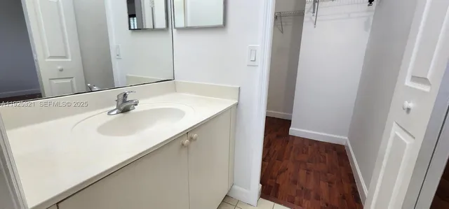 a bathroom with a sink and a shower