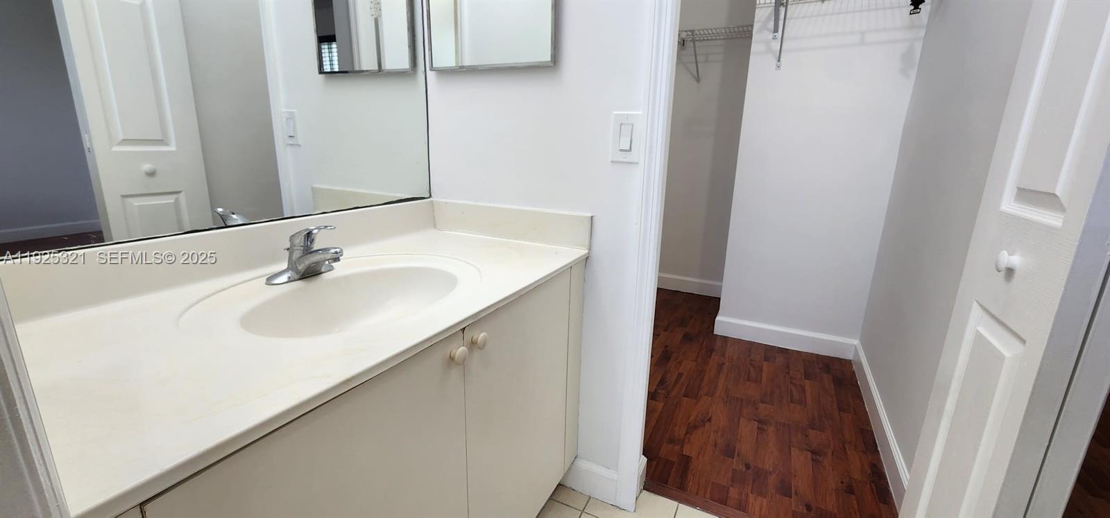 2940 Southeast 15th Terrace, Unit 2940 Homestead, FL 33035 - Photo 11 of 28 a bathroom with a sink and a mirror