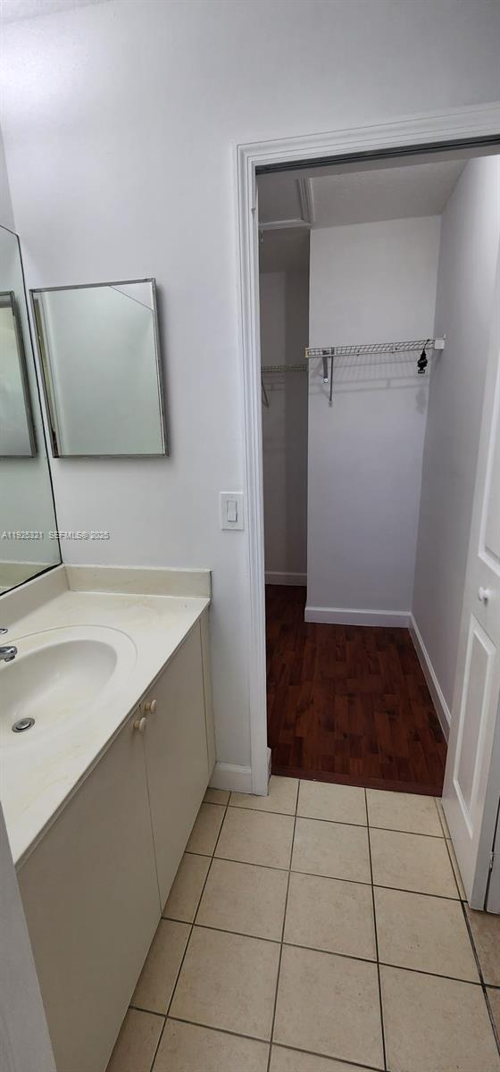 2940 Southeast 15th Terrace, Unit 2940 Homestead, FL 33035 - Photo 12 of 28 a bathroom with a sink and a shower