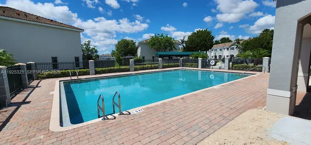a view of a swimming pool with a lounge chairs