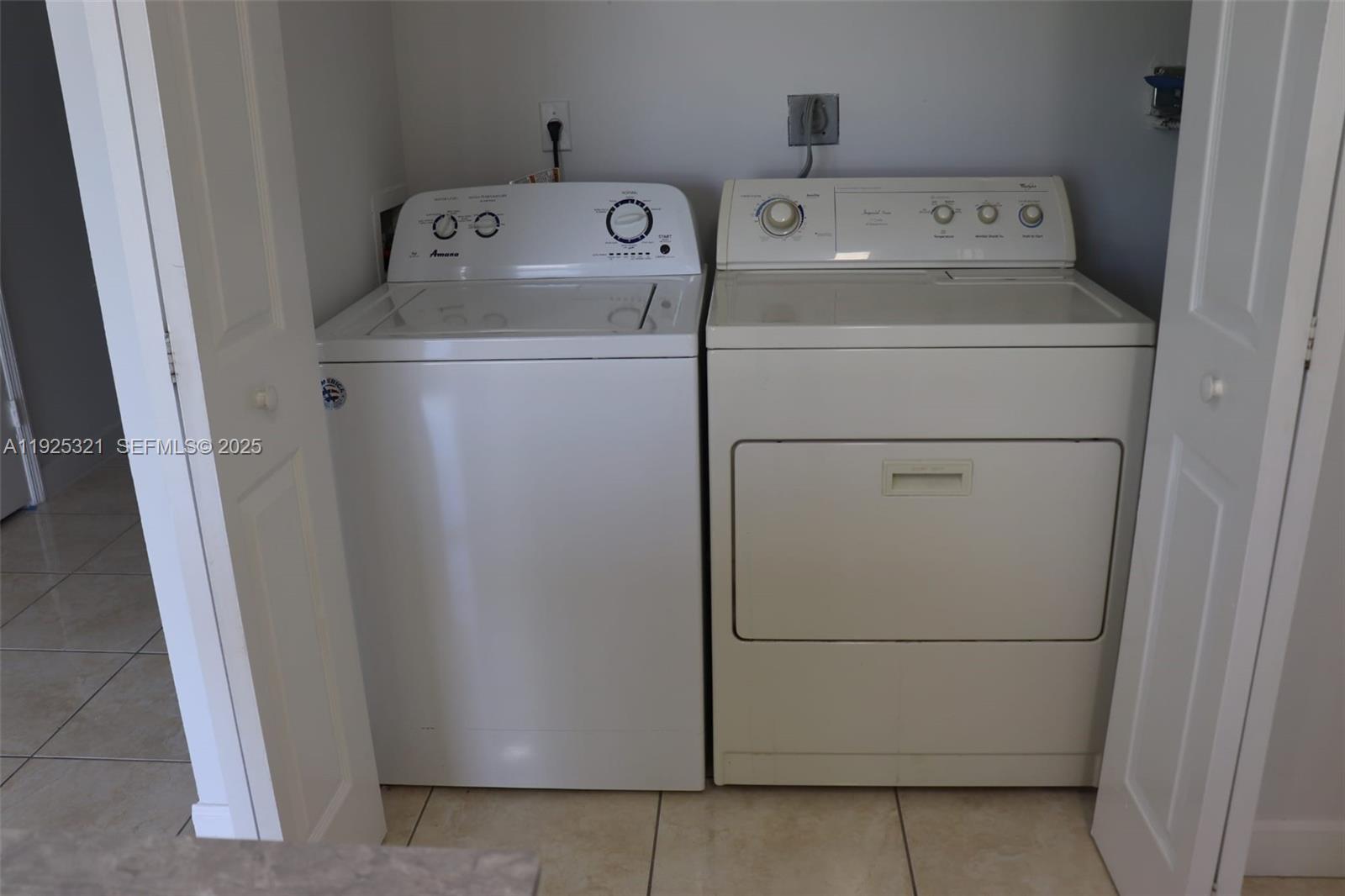 2940 Southeast 15th Terrace, Unit 2940 Homestead, FL 33035 - Photo 8 of 28 a utility room with dryer and washer