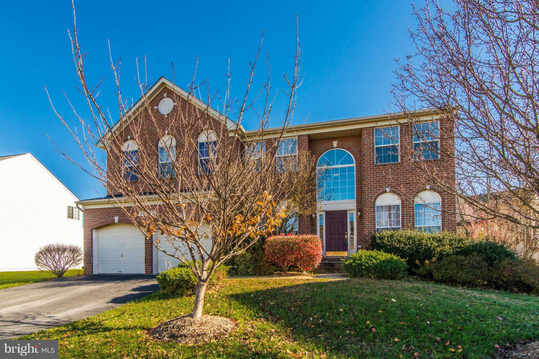 14625 Bubbling Spring Road Boyds, MD 20841 - Photo 1 of 30 a front view of a house with garden
