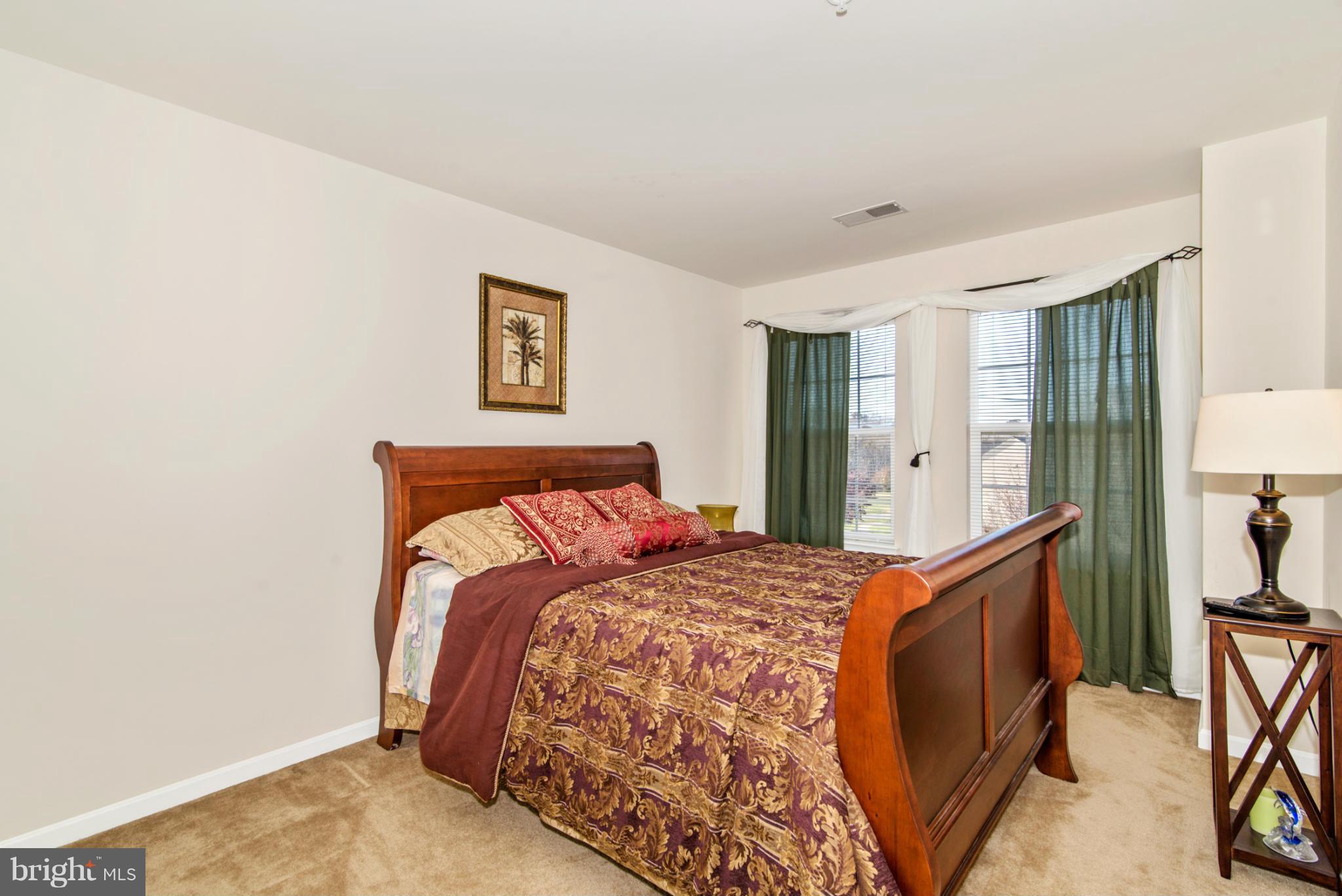 14625 Bubbling Spring Road Boyds, MD 20841 - Photo 21 of 30 a bedroom with a bed and a cabinets