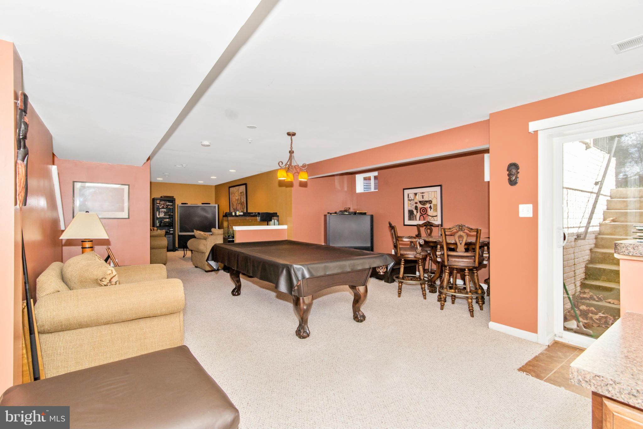 14625 Bubbling Spring Road Boyds, MD 20841 - Photo 24 of 30 a living room with furniture and a large window