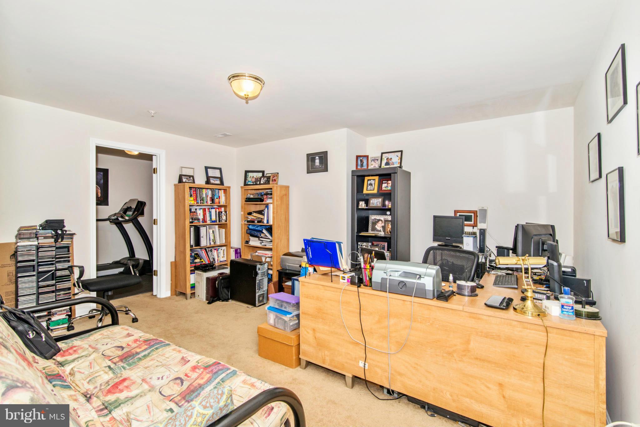 14625 Bubbling Spring Road Boyds, MD 20841 - Photo 28 of 30 a living room with furniture and a flat screen tv