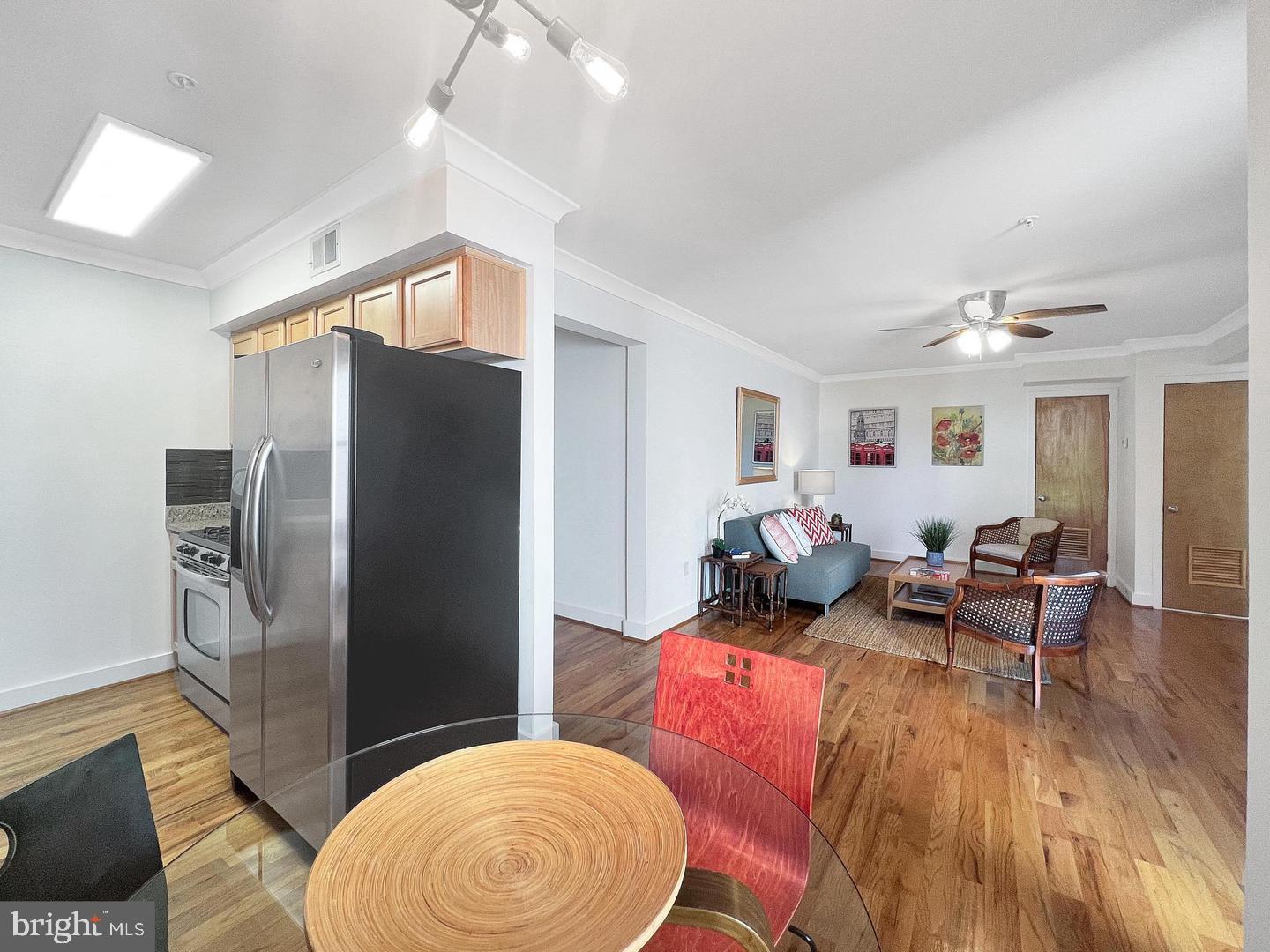 2615 4th Street Northeast, Unit 306 Washington, DC 20002 - Photo 11 of 13 a living room with furniture and a wooden floor