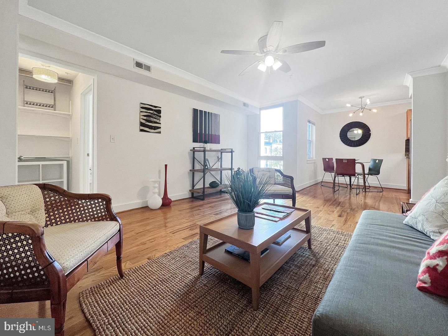 2615 4th Street Northeast, Unit 306 Washington, DC 20002 - Photo 2 of 13 a living room with furniture and wooden floor