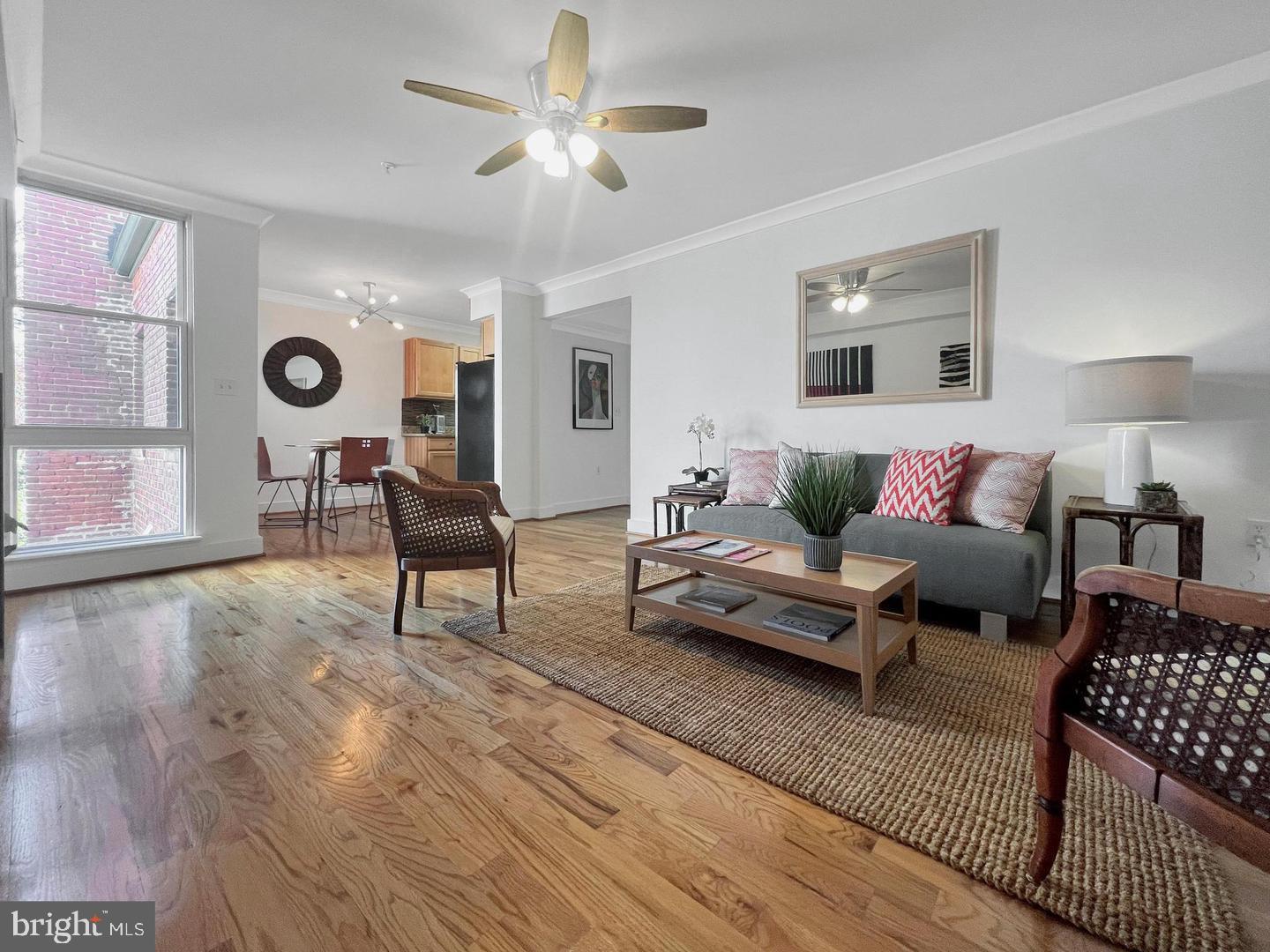 2615 4th Street Northeast, Unit 306 Washington, DC 20002 - Photo 3 of 13 a living room with furniture and wooden floor