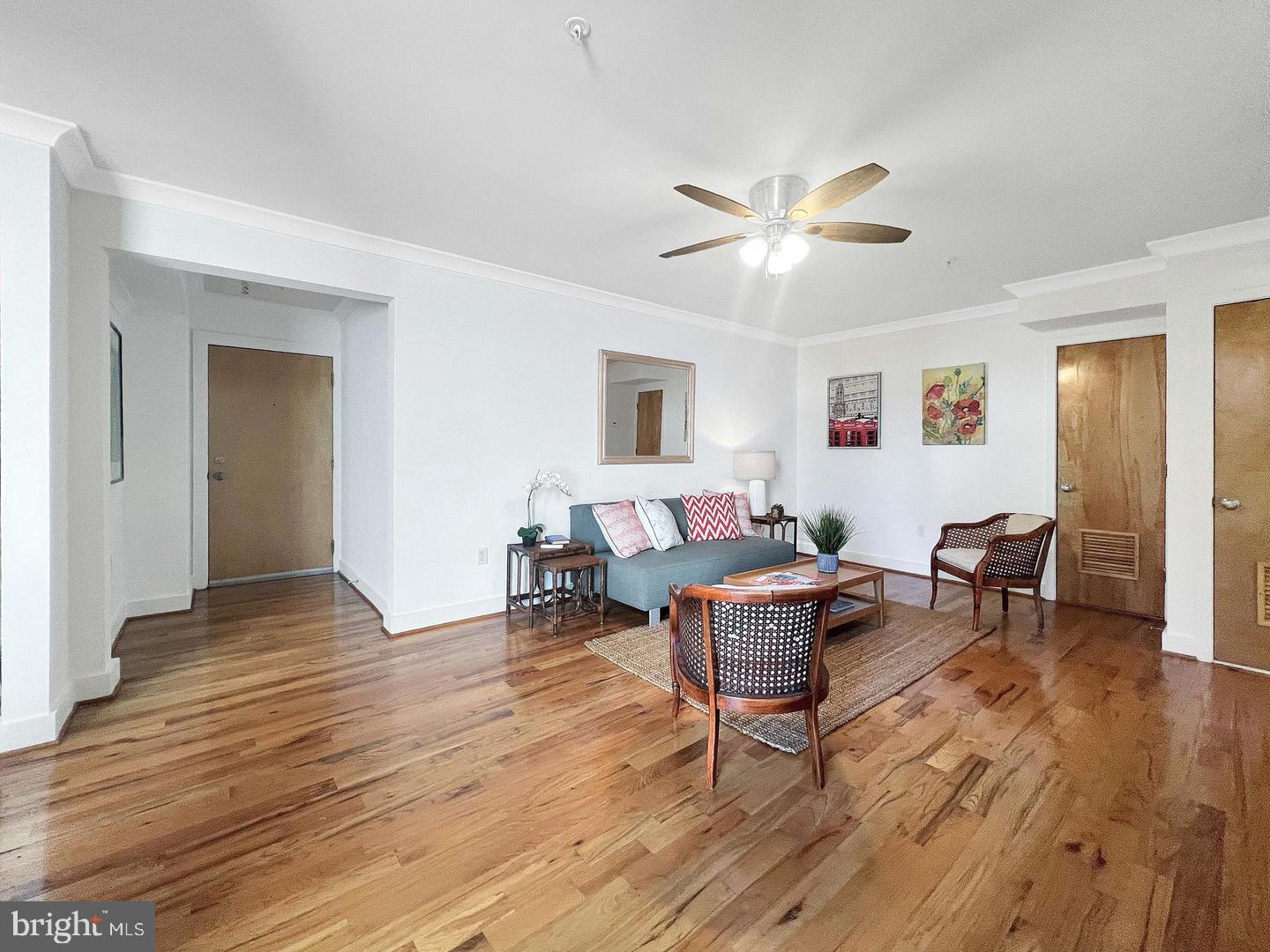 2615 4th Street Northeast, Unit 306 Washington, DC 20002 - Photo 4 of 13 a living room with furniture a dining table and wooden floor